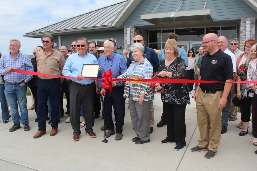 IT’S OFFICIAL! Gregg Smith, Bob Stayton, Christy Maggi, Mayor Carla Moberly and Airport Manager Joel Long were in attendance for the ribbon cutting of Clinton Regional Airport’s new terminal facility.