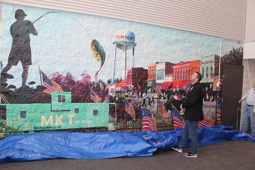 A MAGNIFICENT NEW MURAL was unveiled by Clinton Walmart Manager Matt Cable. The artwork greets shoppers at the west entrance of the store.