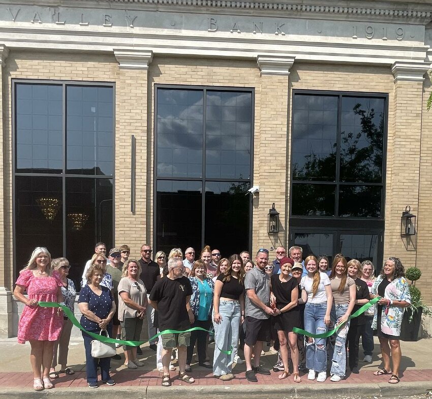 A RIBBON CUTTING was held on Monday, June 2  to celebrate the grand opening of The Vault, a stunning new event venue located in the beautifully restored former Osage Valley Bank building in downtown Warsaw. Owners Danny and Stacey Morrison were joined by their daughters, family members, and friends for the celebration. Also in attendance were representatives from the City of Warsaw, Benton County elected officials, Warsaw Chamber of Commerce, Benton County Tourism & Recreation, Benton County Extension, Small Business Development Center at SFCC, and Benton County Economic Development. The Vault features elegant spaces including a bridal suite and groom’s lounge, offering a one-of-a-kind setting for special events in Benton County.
