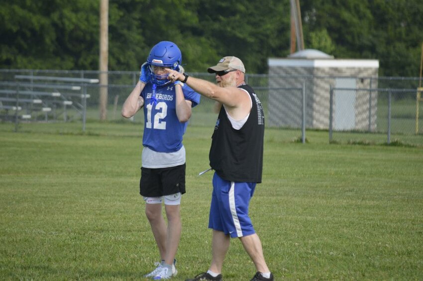 SHOW ME THE WAY, Cole Camp head coach Kevin Shearer directed junior safety Blake Abey through defensive drills during a workout last week. The Bluebirds will look to improve on a 1-win season from a year ago.