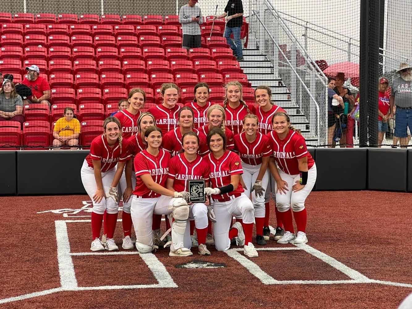 WE COULD GET USED TO THIS!  The Lady Cardinals show off their second tournament championship trophy of the 2022 season that they picked up in Warrensburg on Saturday.  Addison Markham sealed the deal with a walk-off homer, the program's first in a decade.