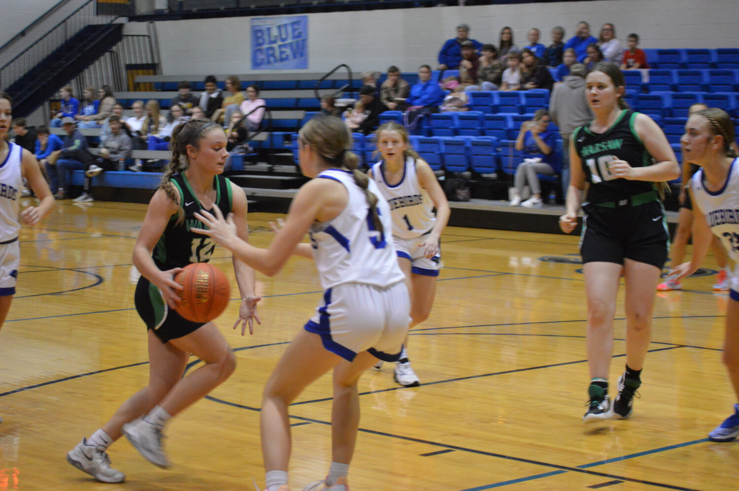 WARSAW'S Tanna Howe drives against Cole Camp's Kaitlyn Whitworth at Cole Camp on Monday night. A close one throughout the first half, Warsaw blew the game open in the third quarter and sailed to a 50-35 victory.