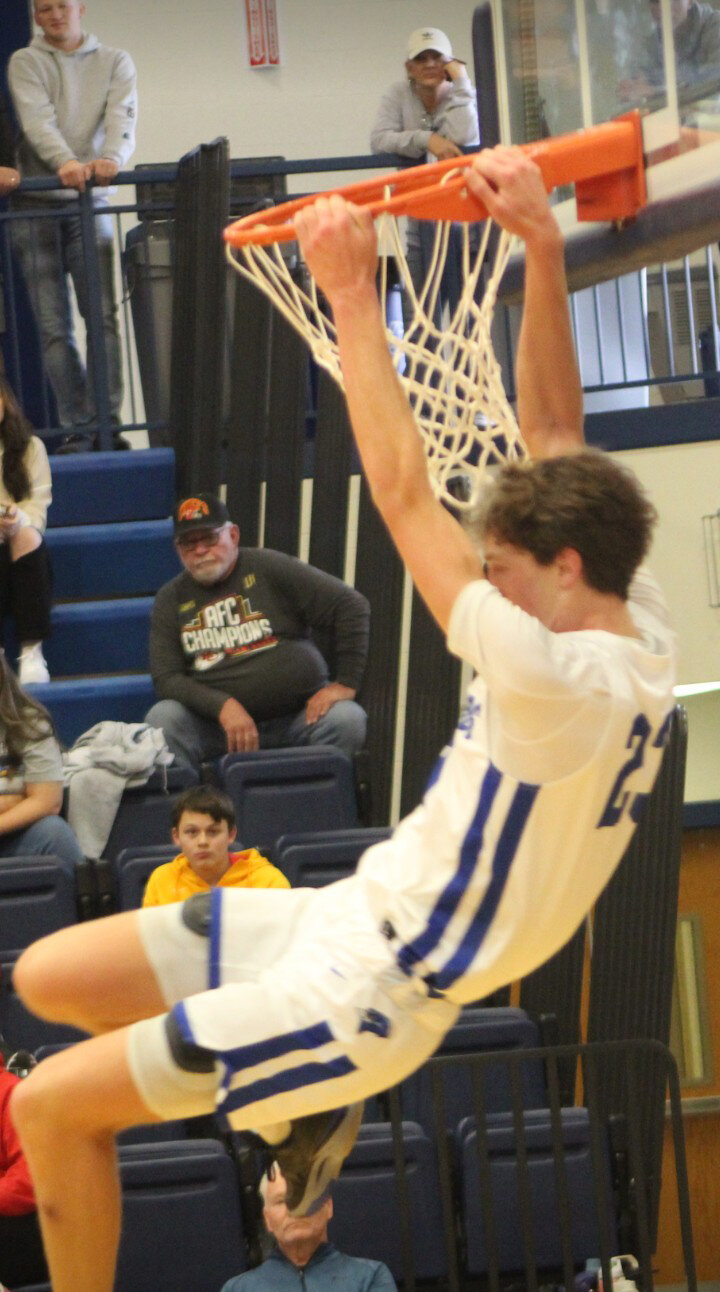 JUST HANGIN' AROUND Cole Camp's Gentry Dieckman dunked in the fourth quarter before fouling out against Stover. The number one seeded Bluebirds took fourth place after a controversial 57-55 loss on Saturday.