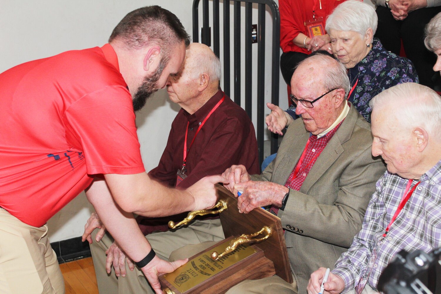 MYSTERY still surrounds the disappearance of Clinton’s 1950 state basketball Championship trophy. A replica was presented during a ceremony to Marvin Rhoads, Bob Shoemaker, Jim Price along with Richard Headrich between basketball games on Friday.