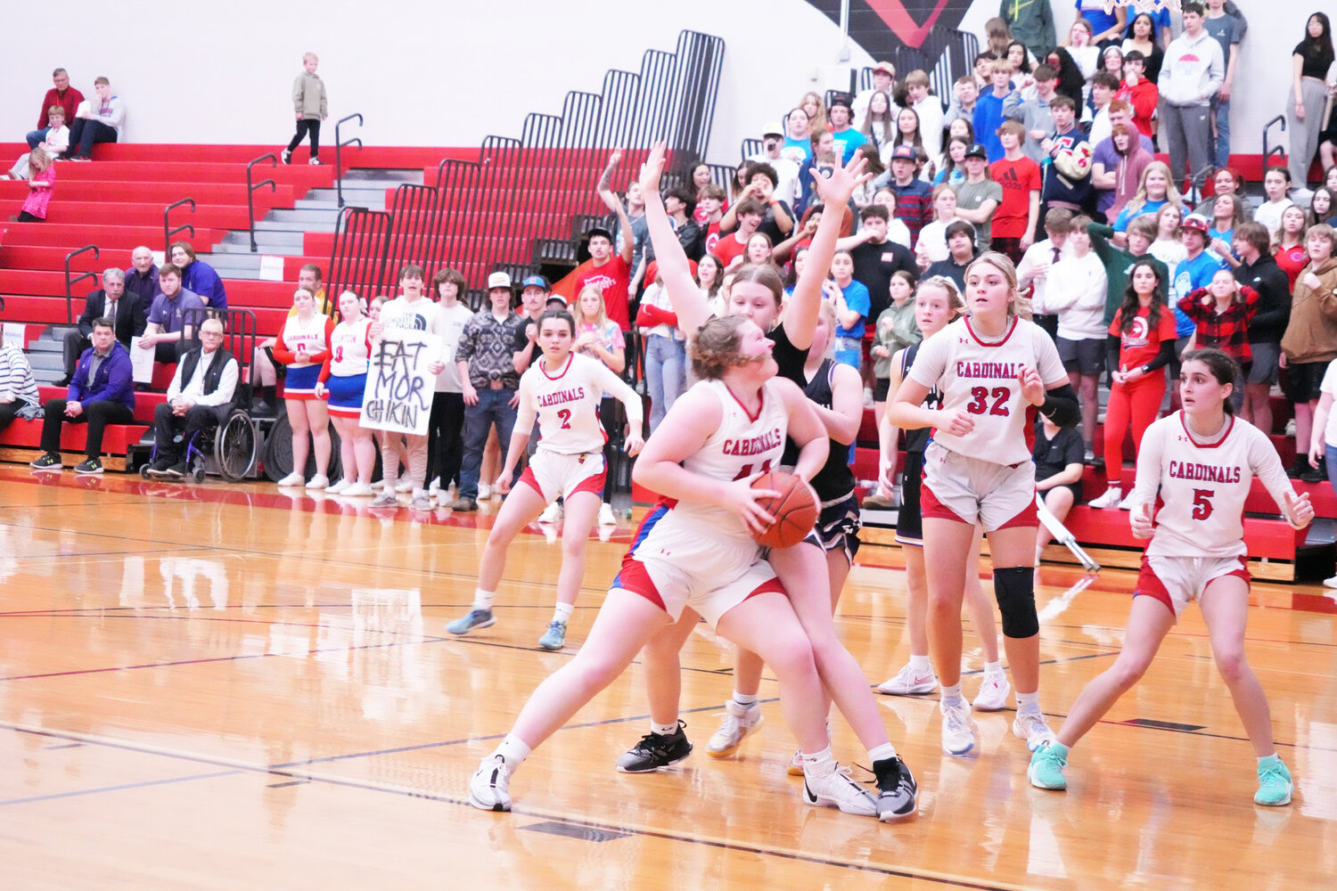 THE LADY CARDS Briley Wishard fought hard for a basket in Clinton's 47-41 loss to Pleasant Hill last Friday.  The basket didn't fall but Wishard did draw the foul and made a trip to the line.