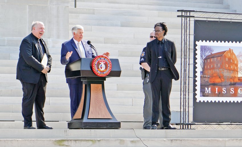 Monsignor Robert A. Kurwicki, vicar general of the Jefferson City diocese and chaplain of the Missouri House of Representatives, joins Gov. Mike Parson and Missouri State University Adjunct Professor James T. Gibson on the steps of the Capitol during the Aug. 10 Statehood Day celebration marking Missouri&rsquo;s 200th anniversary as the 24th state in the Union.