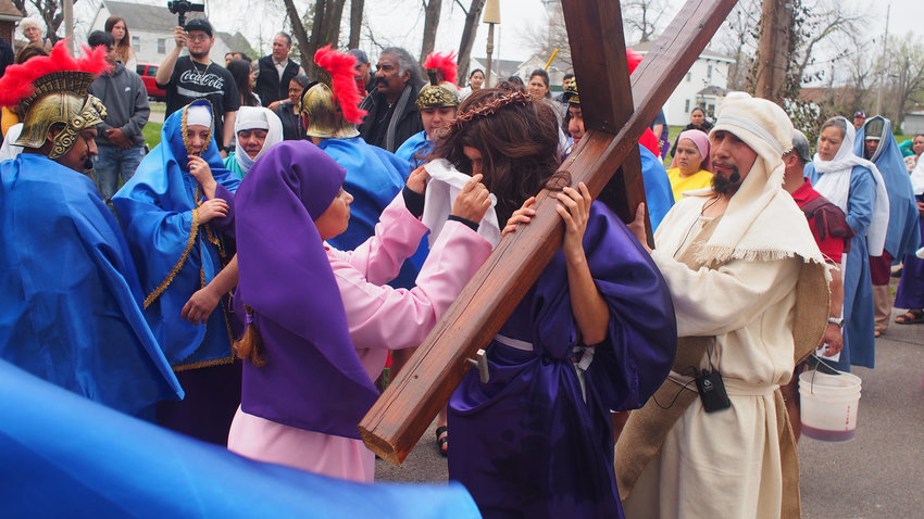 Veronica, played by St. Vincent de Paul parishioner Alyssa Luna wipes Jesus&rsquo; face during an outdoor reenactment of the Stations of the Cross on Good Friday outside St. Patrick Chapel in Sedalia. Jesus was portrayed by Mario Rojas.