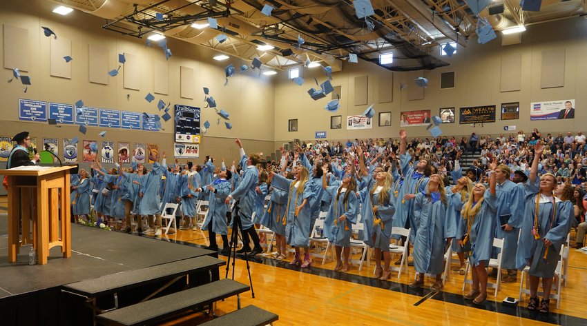 The members of Fr. Tolton Regional Catholic High School&rsquo;s Class of 2022 toss their mortarboards into the air at the end of their graduation ceremony on May 15 in Columbia.