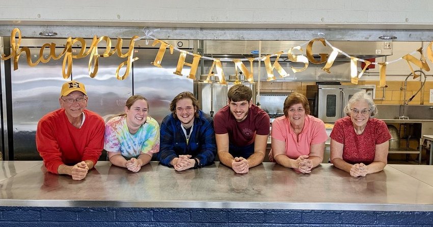 and in the cafeteria of Immaculate Conception School in Jefferson City to prepare and serve Thanksgiving Day meals to people in the community.