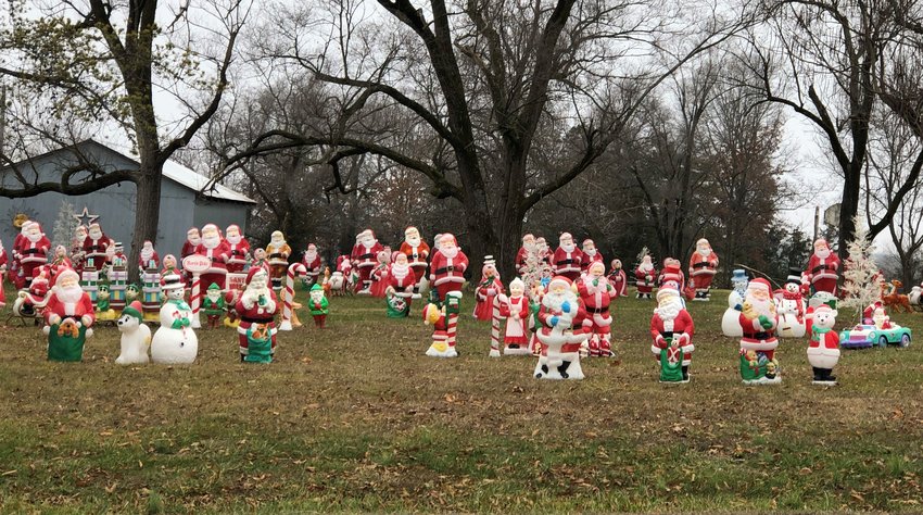 More than 100 vintage blow-mold Santas join a cavalcade of other Christmas characters in the yard of Jim and Georgia Fick, who are members of Visitation Parish in Vienna. Each of the figures lights up at night.