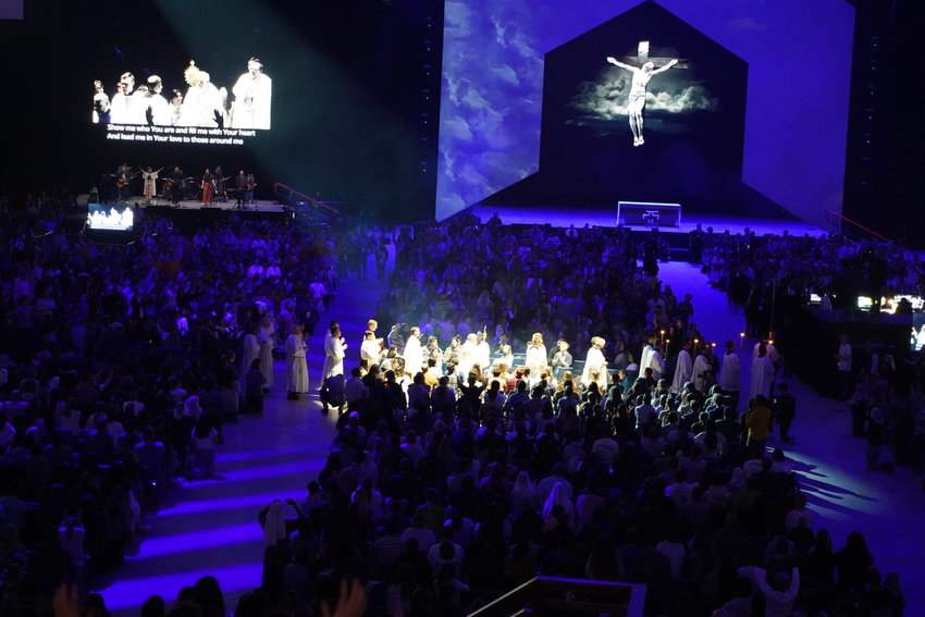 Priests carry the Most Blessed Sacrament around the floor and through the crowd in the Dome at the America&rsquo;s Center in St. Louis Jan. 6 during Adoration attended by over 17,000 people during the SEEK23 conference organized by the Fellowship of Catholic University Students (FOCUS).
