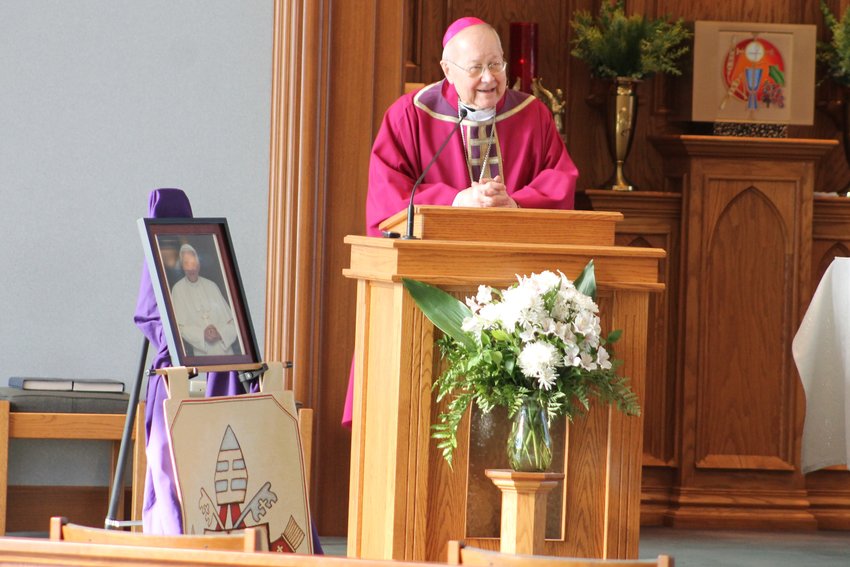 Bishop Emeritus John R. Gaydos, who led the Jefferson City diocese from 1997 to 2018, preaches the homily during the See City Deanery&rsquo;s Memorial Mass for Pope Emeritus Benedict XVI on Jan. 6 in St. Andrew Church in Holts Summit.