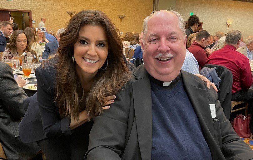 Rachel Campos-Duffy, keynote presenter at the Don and Ruth Ann Schnieders Pro-Life Event on March 21, stops for a photo with Monsignor Robert A. Kurwicki, vicar general of the Jefferson City diocese, who led the opening prayer for the event.