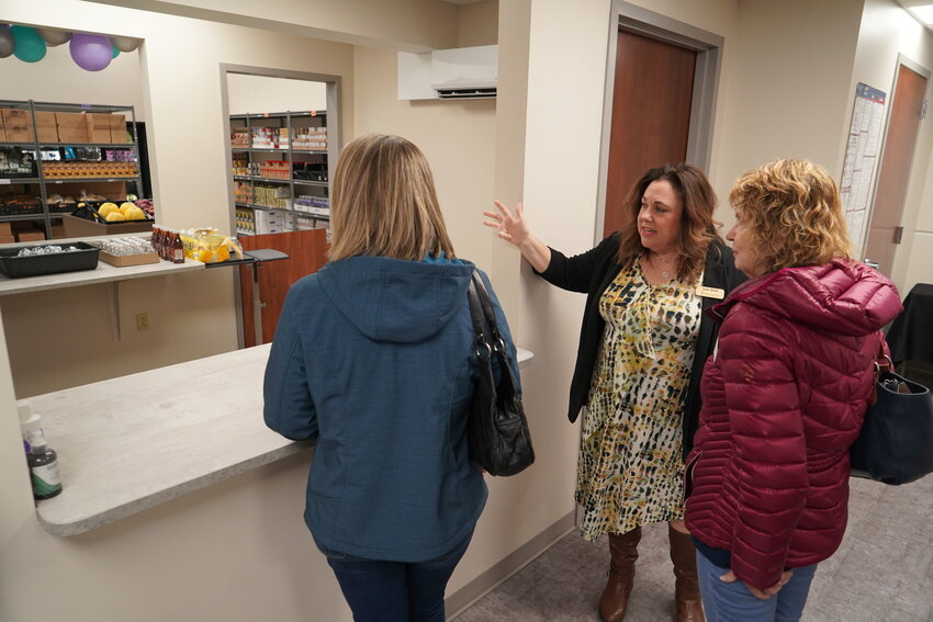 Lori Stoll, food programs coordinator for Catholic Charities of Central and Northern Missouri, gives tours of the agency&rsquo;s client-choice food pantry in Jefferson City during a festive open house on March 21 to celebrate the pantry&rsquo;s one-year anniversary.