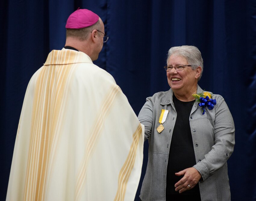 Bishop W. Shawn McKnight congratulates Sister Jean Dietrich SSND after presenting her the Cross Pro Ecclesia et Pontifice (&ldquo;Cross for the Church and Pontiff&rdquo;) medal in October 2021, in recognition of distinguished service to the Church and papacy.