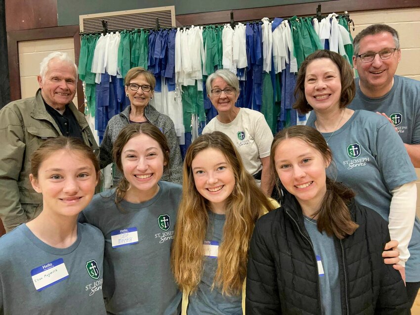 Members of Cathedral of St. Joseph Parish in Jefferson City take part in various service activities April 30 during the parish&rsquo;s St. Joseph Serves Day.