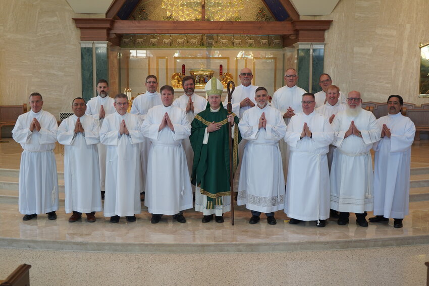 Fifteen candidates for the Permanent Diaconate &mdash; (First row) Michael Dorrell, Osmaro DeLeon, Robert Czarnecki, Kenneth Arthur, Edward Galbraith, Dwayne Goodwin, James Rangitsch Jr., Charles Ochoa, (second row, far right) Brian Lutz, (third row) Harvey Million Jr., Chad Freie, Louie Delk, Denis Gladbach, Keith Henke and Mark Oligschlaeger &mdash; join Bishop W. Shawn McKnight in the sanctuary of the Cathedral of St. Joseph Nov. 5 after he instituted them as lectors.
