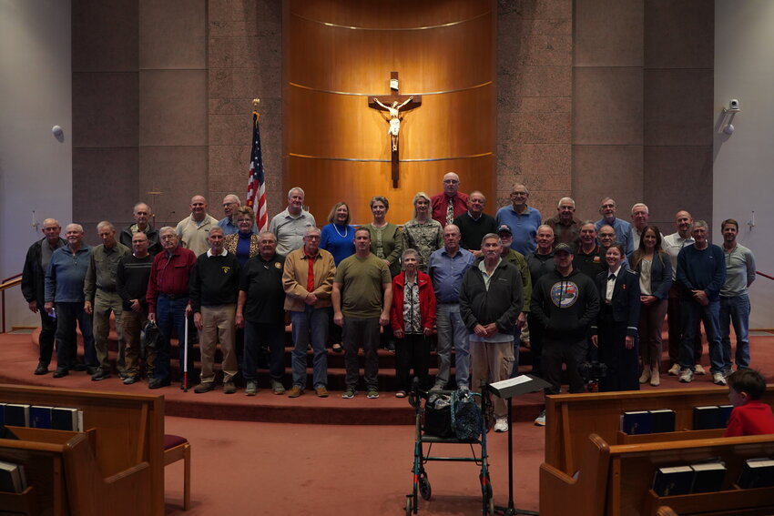 Honored veterans gather in the sanctuary of Our Lady of Lourdes Church in Columbia following a Veterans Day Assembly with Our Lady of Lourdes Interparish School students Nov. 10.