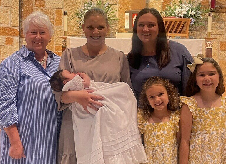 Paulette Bruch, president of the Anne&rsquo;s Anchor Board of Directors; Elizabeth and Constantine; Georgia Hearn, Anne&rsquo;s Anchor Executive Director and her daughters Caelyn and Raelyn gather for Constantine&rsquo;s Baptism earlier this year. Elizabeth and Constantine are residents of the Anne&rsquo;s Anchor maternity home in Bowling Green.
