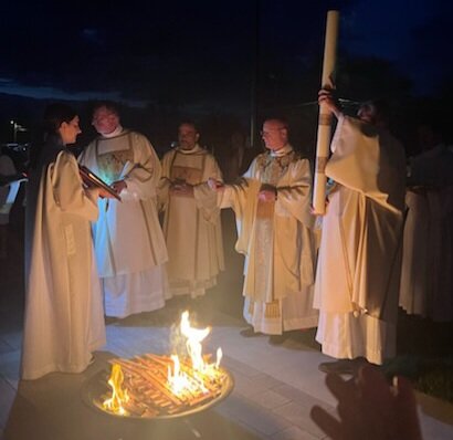 Bishop W. Shawn McKnight blesses the fire for the Easter candle outside the Cathedral of St. Joseph at the beginning of the Easter Vigil.
