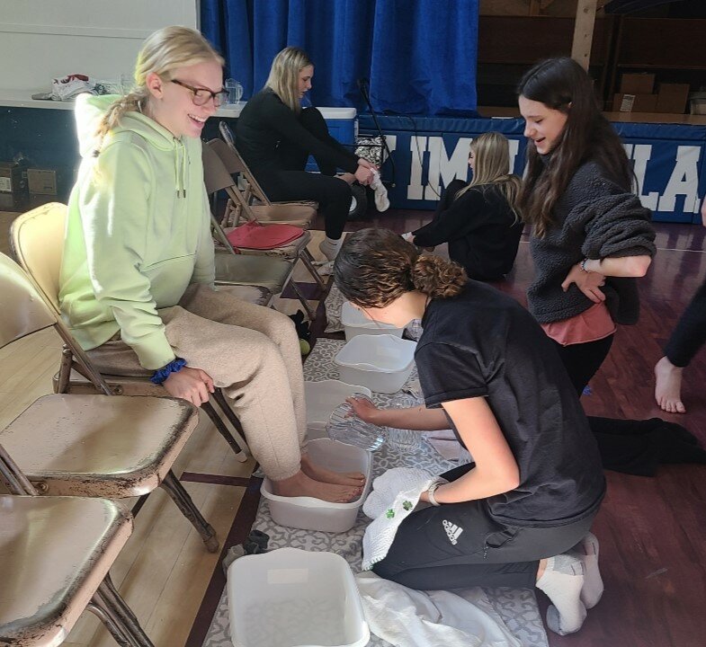 Students in Julia Murmylo&rsquo;s seventh- and eighth-grade class at Mary Immaculate School in Kirksville wash the feet of their schoolmates after explaining the significance of &ldquo;Maundy&rdquo; Thursday during Holy Week.
