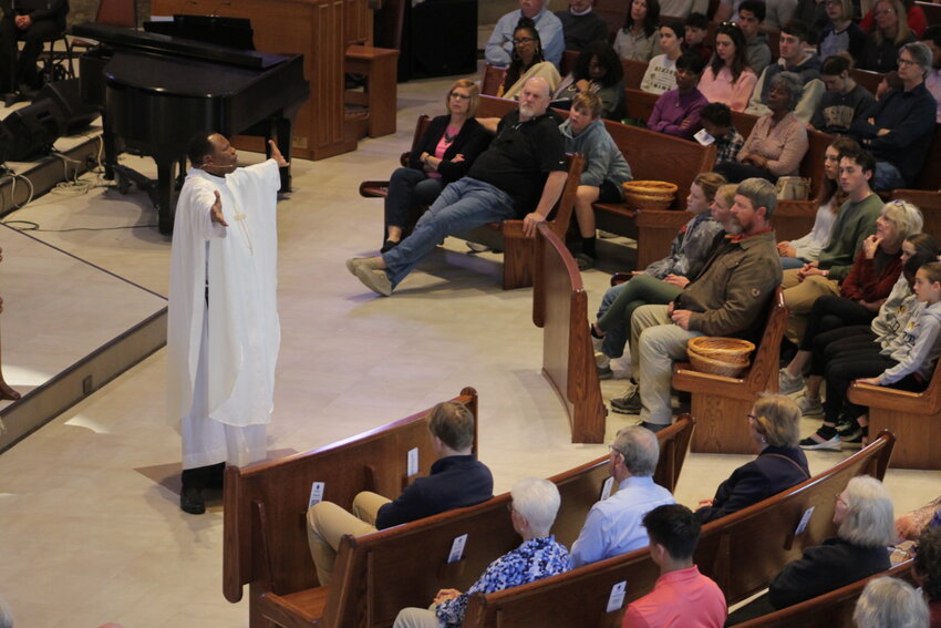 Father Joseph Luzindana preaches the homily at the Father Tolton Celebration Mass on April 21 in St. Thomas More Newman Center in Columbia.