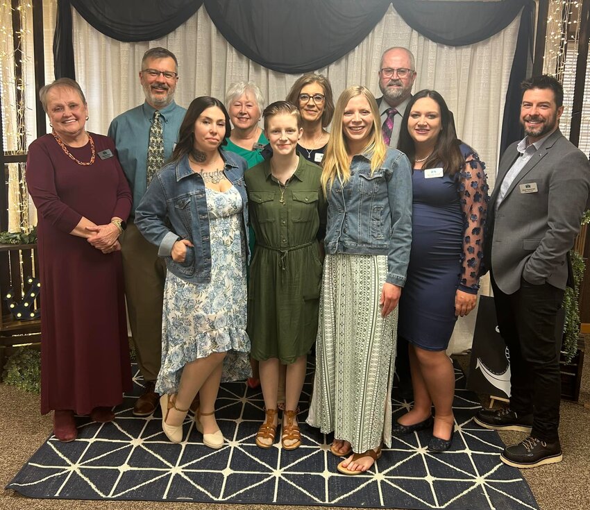 Board members, staff and residents of the Anne&rsquo;s Anchor home in Bowling Green gather during the interfaith agency&rsquo;s VIP Banquet March 21 in the St. Clement Knights of Columbus Hall.