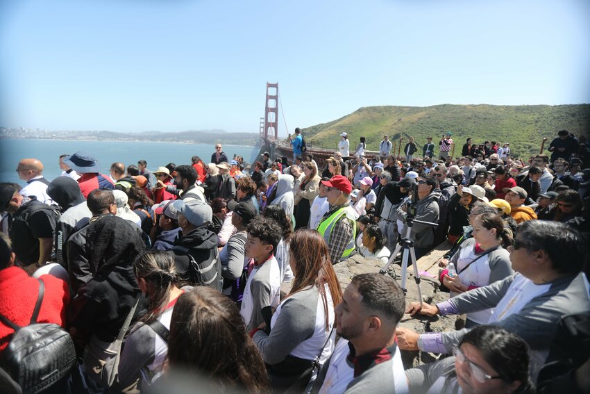 People look on as San Francisco Archbishop Salvatore J. Cordileone blesses the city and pilgrims after leading a procession across the Golden Gate Bridge May 19, 2024. The event was celebrated for the western route of the National Eucharistic Pilgrimage, during which pilgrims from across the United States will travel with the Eucharist for the next eight weeks on their way to the National Eucharistic Congress, scheduled for July 17-21, 2024, in Indianapolis.