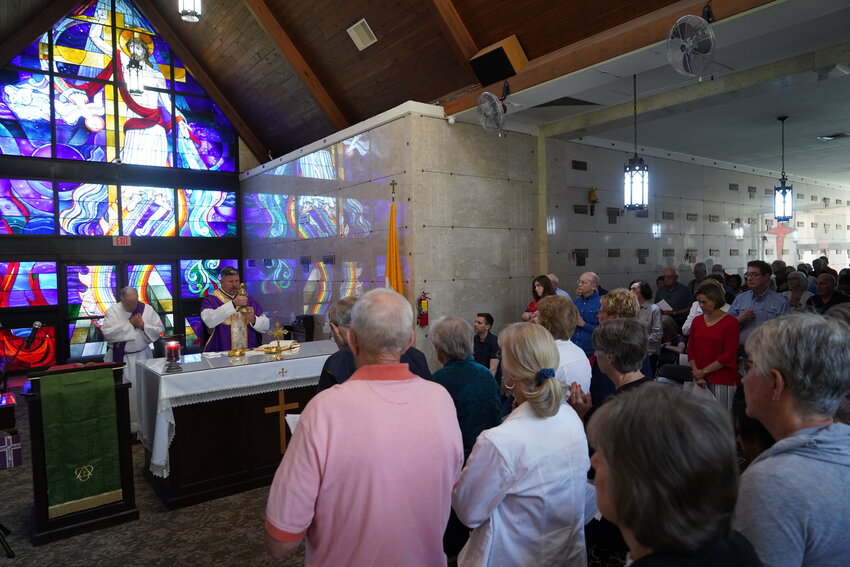 Father Stephen Jones offers Mass on Memorial Day amidst the marble-clad vaults in the Resurrection Cemetery Mausoleum in Jefferson City.