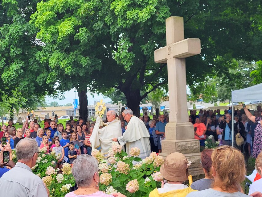 Bishop Thomas J. Paprocki of Springfield, Illinois, conducts a solemn Benediction at the burial place of Venerable Father Augustus Tolton in St. Peter Cemetery in Quincy, Illinois, July 9, the 127th anniversary of Fr. Tolton&rsquo;s death, following a Eucharistic procession as part of the National Eucharistic Revival.