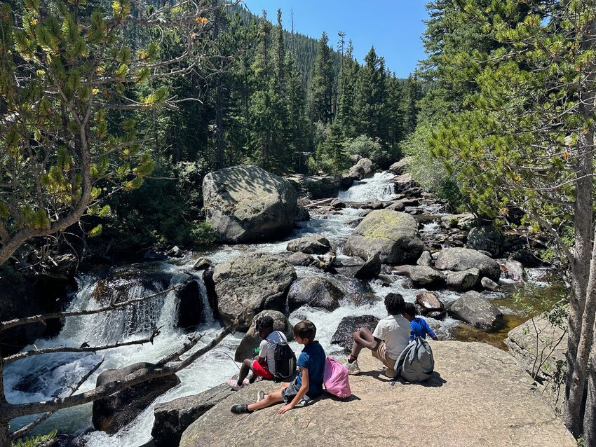 Students of St. Nicholas Academy take in the view while on a hike during their summer road trip to Colorado in July.
