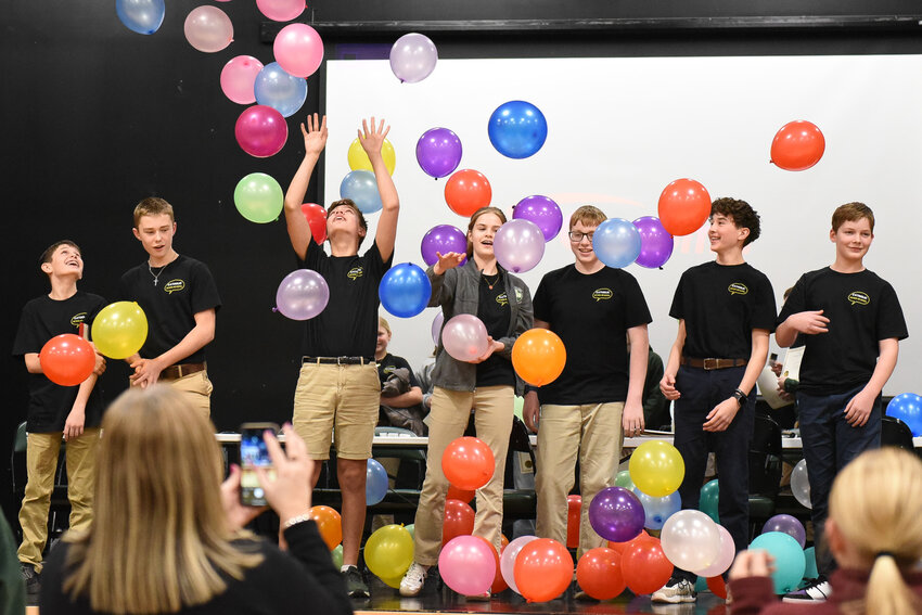Students of various Catholic schools who made up Team D in the diocese&rsquo;s inaugural Seventh Grade Scholar Bowl revel in their victory.