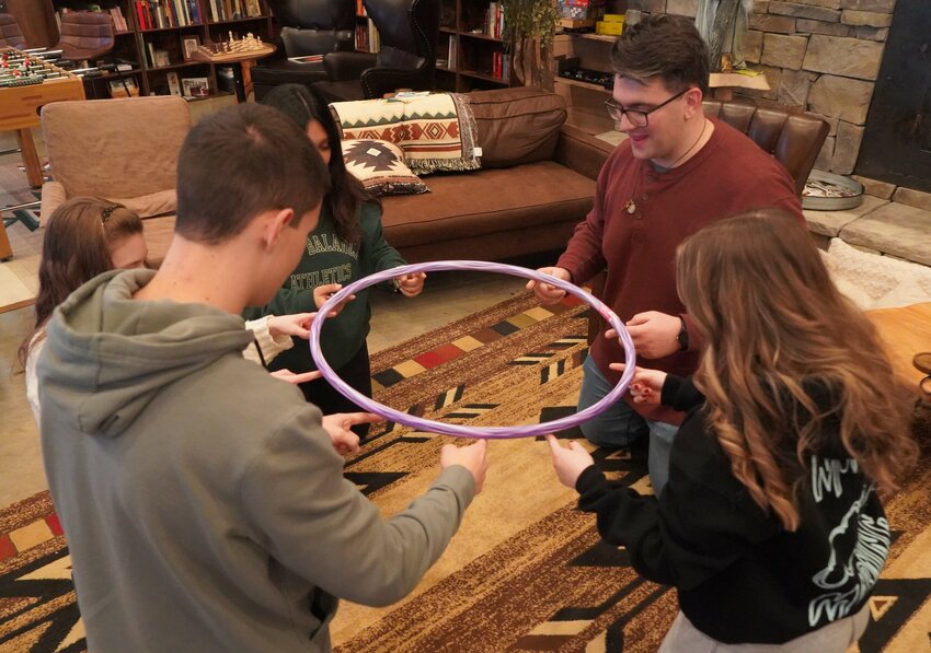 Members of the Diocesan Youth Advisory Council take part in an instructive team-building exercise during their annual retreat Feb. 16 at Camp Tolton in Shelby County. The council is one of several deliberative bodies made up mostly of laypeople in the diocese who advise the bishop on important matters.