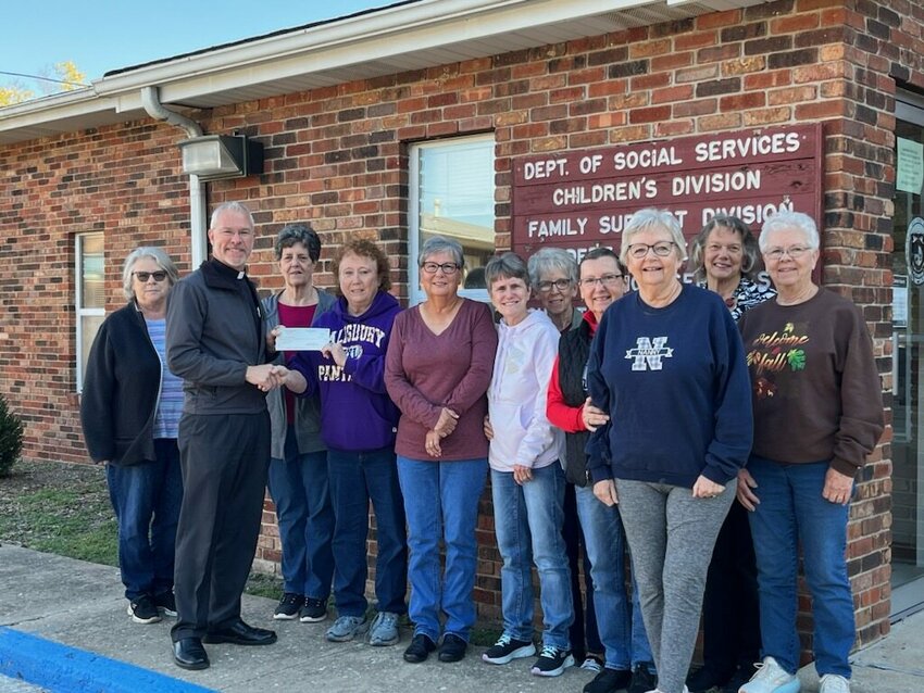 Representatives of St. Joseph Parish in Salisbury present a Charity and Mercy grant received from Catholic Charities of Central and Northern Missouri to Chariton County Family Services.