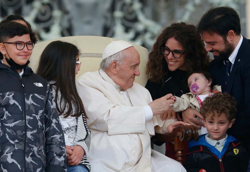 Pope Francis greets visitors during his general audience in St. Peter's Square at the Vatican May 4, 2022.