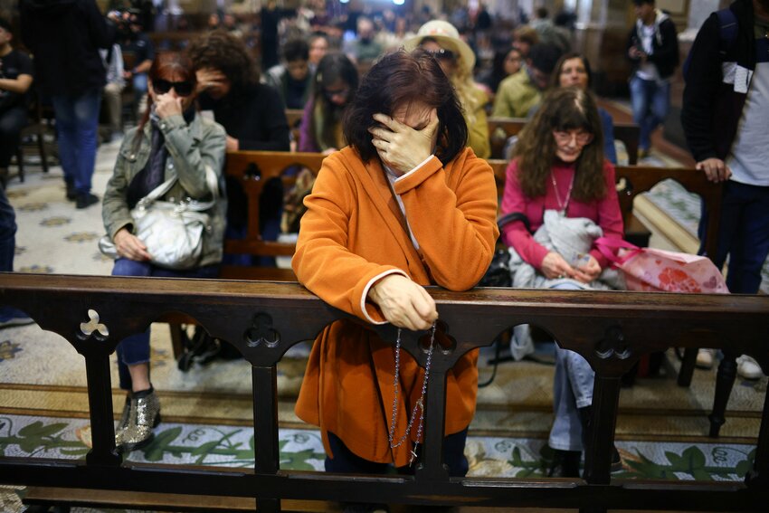 A woman prays inside Buenos Aires' Metropolitan Cathedral  in Buenos Aires, Argentina, April 21, 2025, after the death of Pope Francis was announced by the Vatican. Pope Francis, formerly Argentine Cardinal Jorge Mario Bergoglio, died April 21, at age 88.