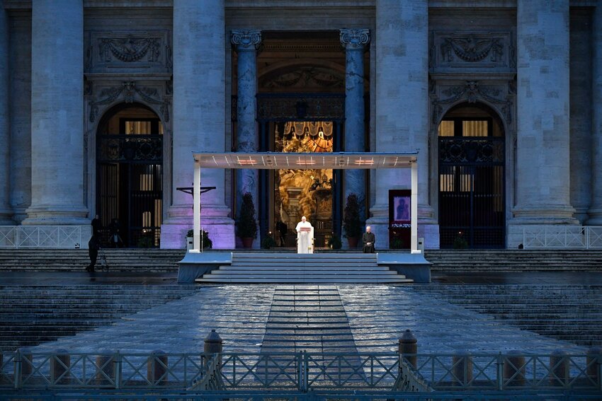 Pope Francis leads a prayer service in an empty St. Peter's Square at the Vatican in this March 27, 2020, file photo. The Vatican has published a book commemorating the prayer service, which made a strong impression on people around the world in the same month COVID-19 was declared a global pandemic.