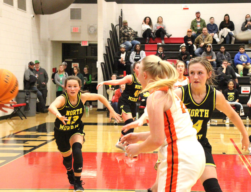 North Murray&rsquo;s Lauren Davis (13) and Abby Young (14) pressure the inbounds pass against LaFayette on Monday in region tournament play at Sonoraville.