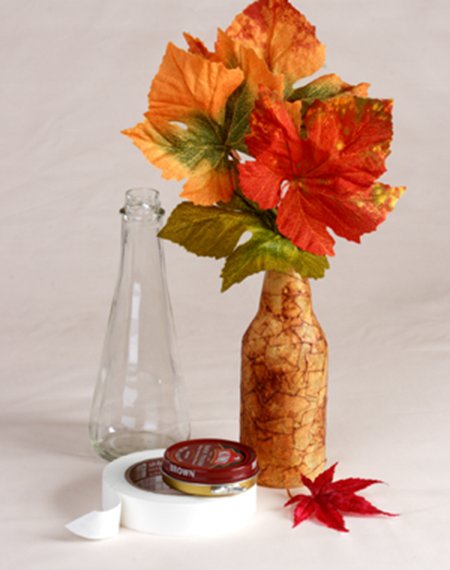 Colorful leaves in faux leather vase