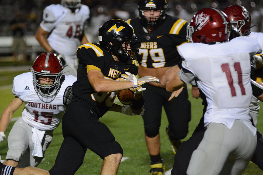 Neers running back Ethan Dempsey rips off along run against Southeast on Friday.