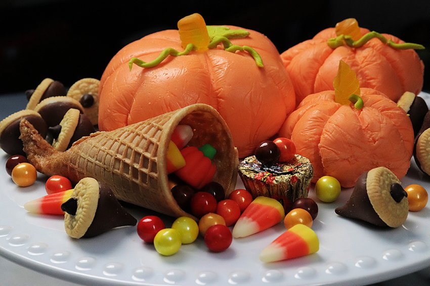 Sugary pumpkins and candy acorns make for kid-friendly holiday table.