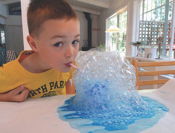 Five-year-old Joshua Adams creates a bubble-art greeting card.