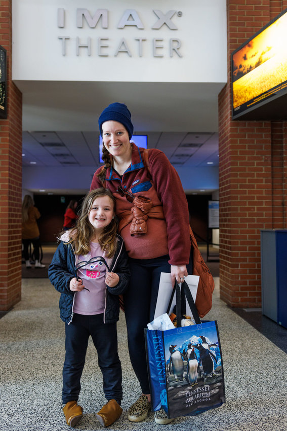 Amanda Brock and her daughter, Leni Kate Brock, are the Tennessee Aquarium IMAX 3D Theater's 9 millionth guests.