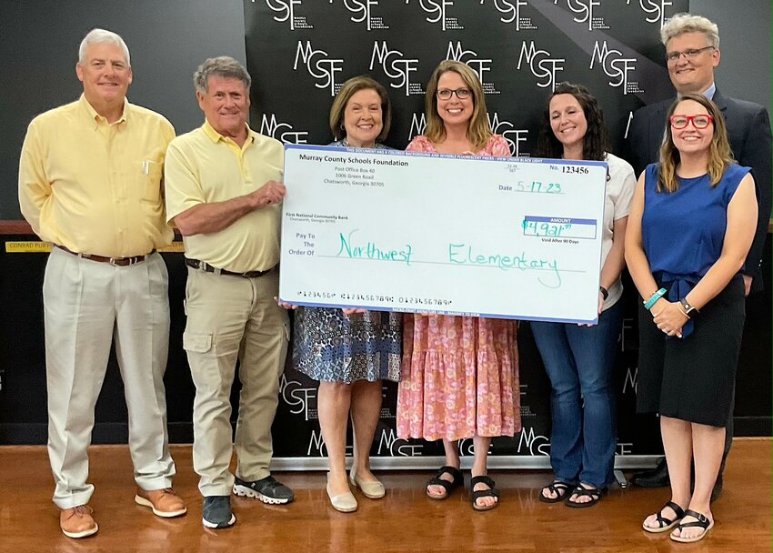 Pictured are Superintendent Steve Loughridge, Foundation board member John Waters, board member Phenna Petty, Amy Petty (principal), Jennifer Dubee,  Derichia Lynch (communications coordinator) and board member Chad Pannell.