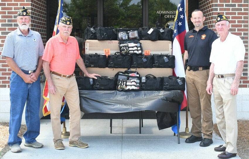 American Legion Post 167 members recently donated funds to purchase 47 first aid bags for use by each Murray County Sheriff's Office deputies. Pictured are (from left), Gary Woodring (Legion senior vice president), Larry Morrison (President), Murray County Sheriff Jimmy Davenport and Legion member Bruce Kendrick.