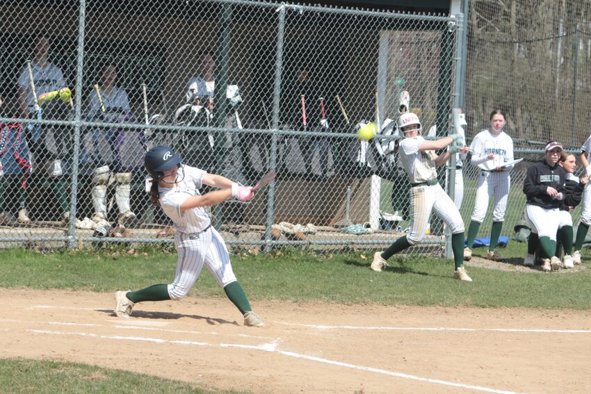 ME Hornet Halle Bouchie takes a mighty swing in a game against Rockport at Sweeney Park on Monday.  The game turned out to be a rout as ME won the match 30-5.