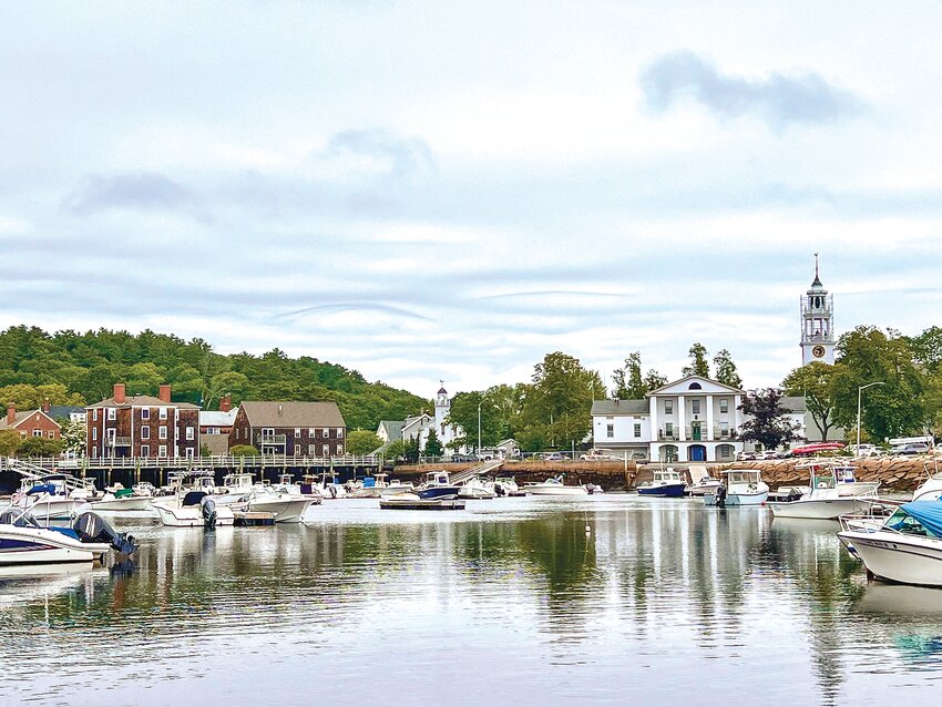The morning peace of Manchester’s inner harbor, shot from Ashland Avenue, is the perfect vantage point to see the Central Street Culvert, located just to the left of Seaside One.  Plans to upgrade the culvert in the face of sea level rise, despite years of planning, continues to be fraught.
