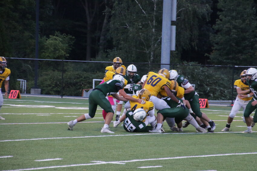 The Hornets defense played a big part in their home opener Friday night as they beat Greater Lowell Tech 22-7 on a brand-new Hyland Field. Photo Paul Clark