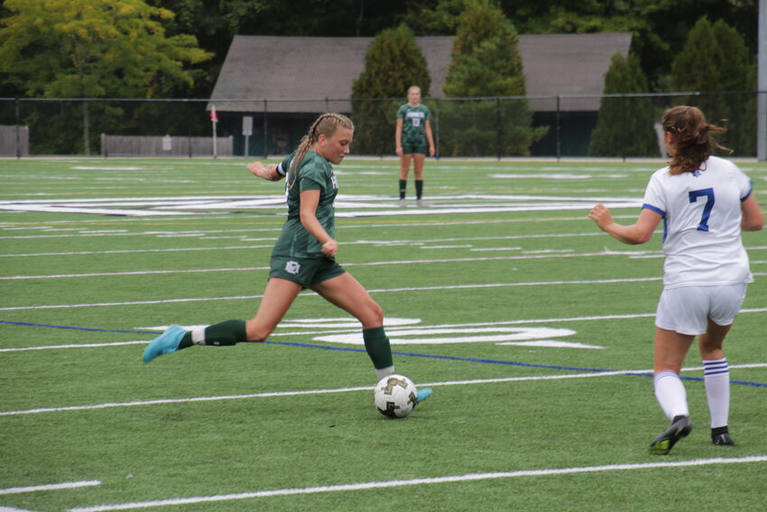 ME Hornet Charlotte Crocker takes control of the ball as she faces the Stoneham defense.  The Hornets played to a 1-1 tie at a new Hyland Field.