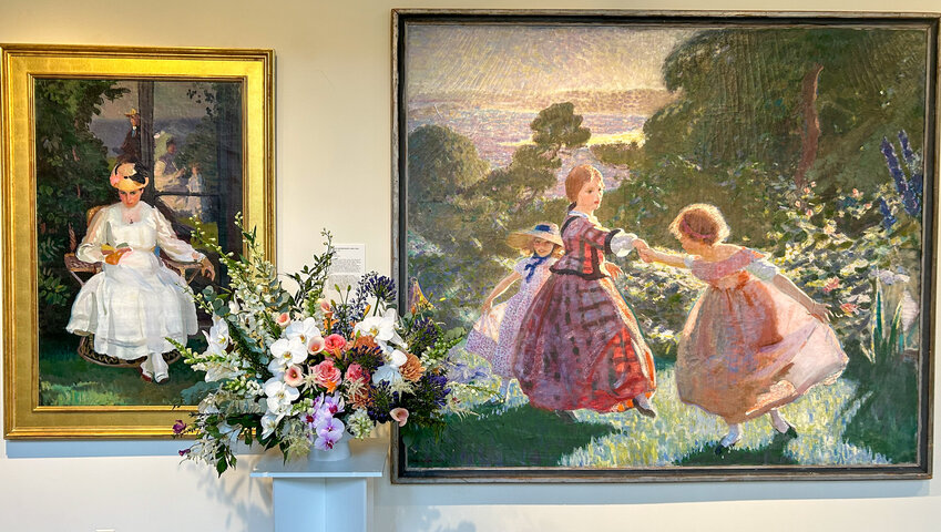 Two paintings by Charles Hopkinson on display at the Cape Ann Museum inspired a beautiful floral arrangement as part of the museum’s popular annual “Blossoms” event this month.